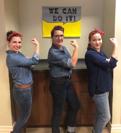 Bank employees dressed up as Rosie the Riveter